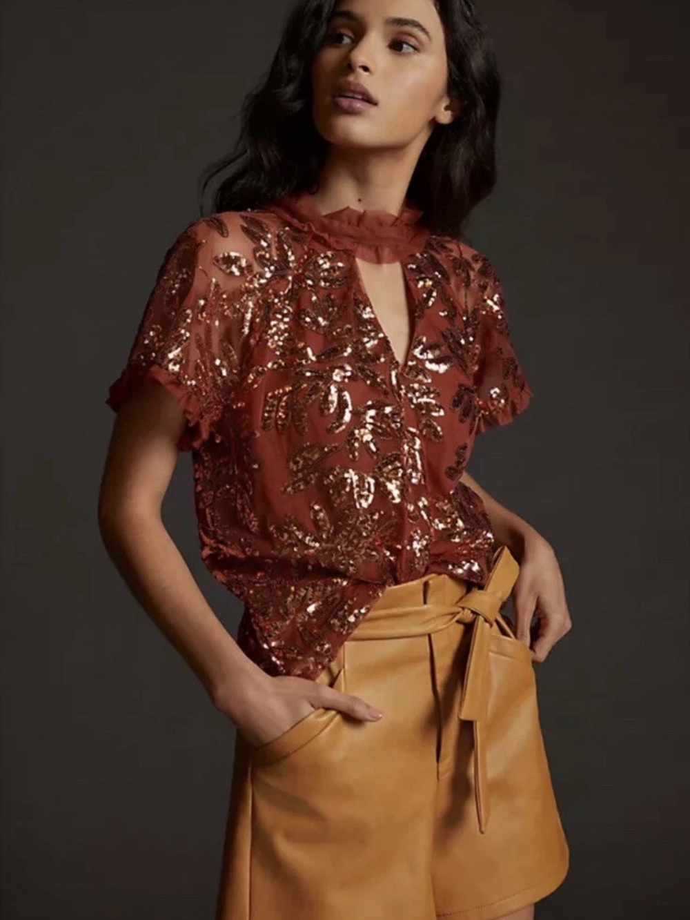347. Anthropologie burnt orange short-sleeve blouse featuring gold sequin floral